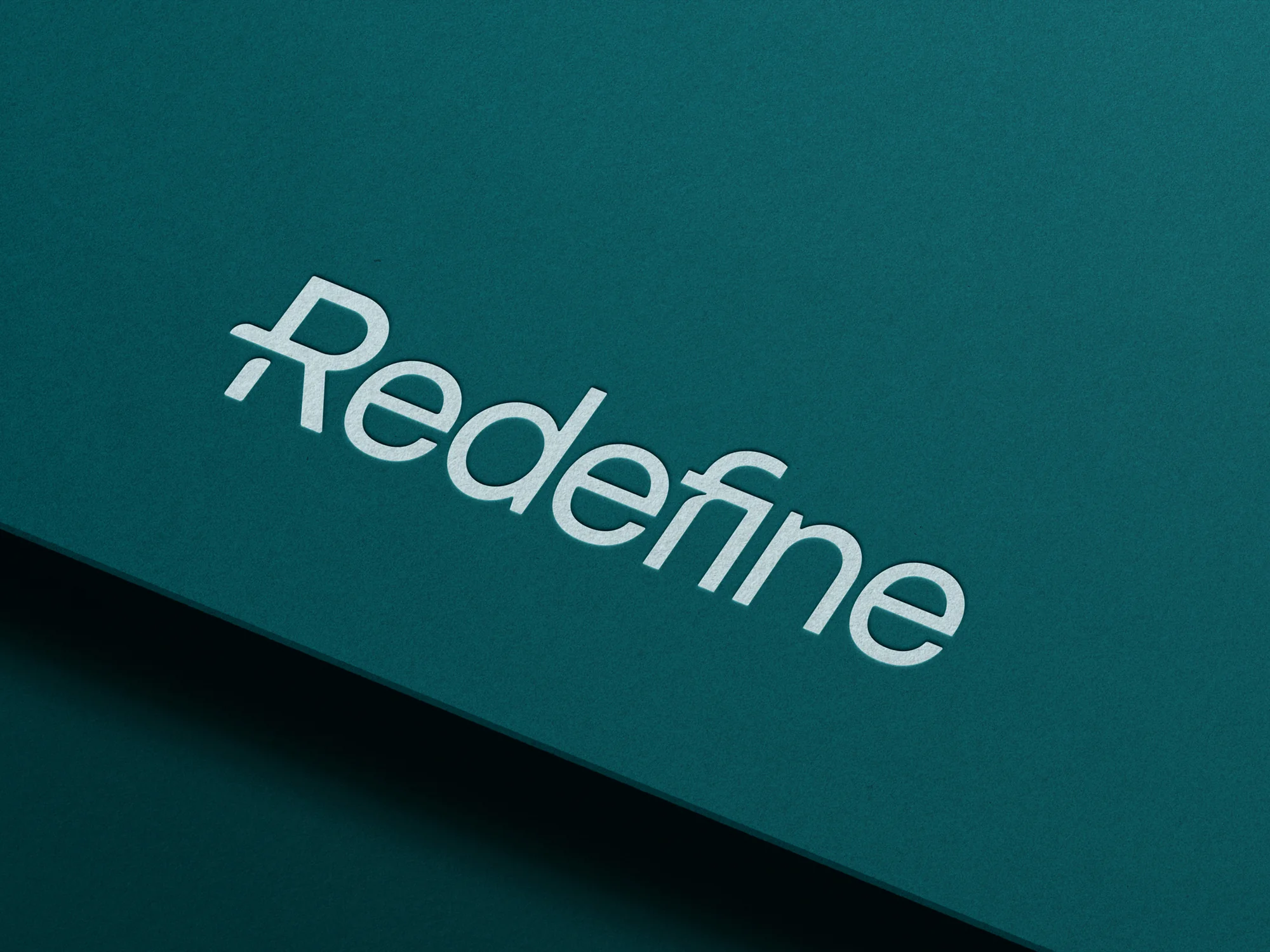 Redefine HR debossed logo on cover stock.